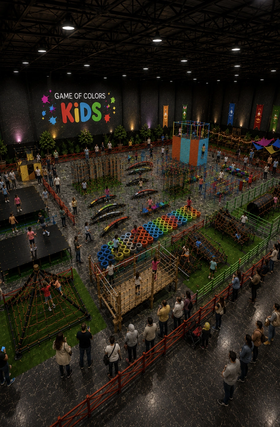 Game of Colors Kids salonundaki renkli tırmanma kulesi, ip köprüler, lastik parkurları ve denge istasyonlarının yukarıdan görünümü